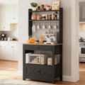LIKIMIO Baker Rack with Spill-Safe Power Outlet & Drawer, Coffee Bar Cabinet with Storage, Farmhouse Microwave Stand with Hutch and 5 Hooks for Kitchen, Black